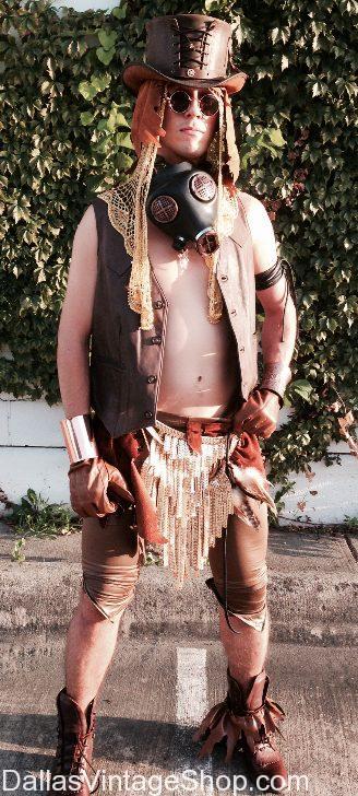 Burning Man Gear, shown here, includes Eclectic Goggles, Leather Steampunk Top Hat, Dread Lock Wig, Supreme Quality Crafted Gas Mask, Nomad Leather Vest, Gold Metallic Tasseled Loin Cloth, Tight Rustic Leather Mens Tights, Arm Bands, Arm Cuffs.